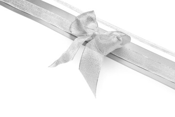 Beautiful silver bow with ribbons on white background