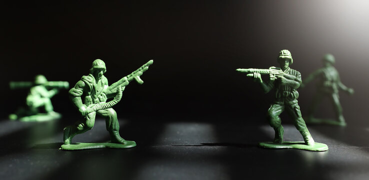 image of toy soldiers over dark background