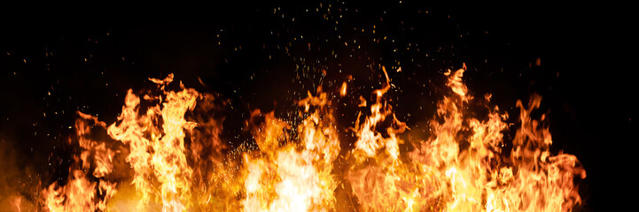 Fototapeta na wymiar Fire flames on black background. fire burst texture for banner backdrop.