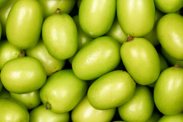 Close up Fresh Neem fruit top view. Neem fruit is an excellent moisturizing and contains various compounds that have insecticidal and medicinal properties.