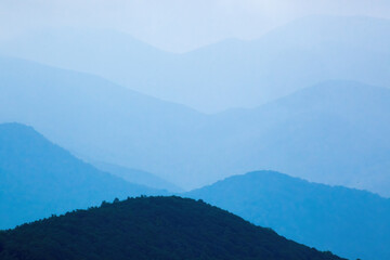 Naklejka premium Distant mountains in blue