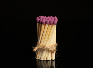Bunch of matches on black background. Concept of unity