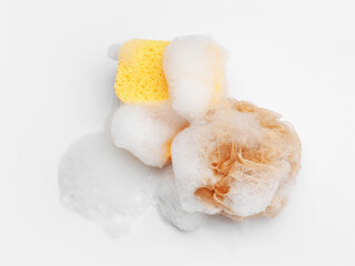 Soft soapy sponges with foam isolated on white background