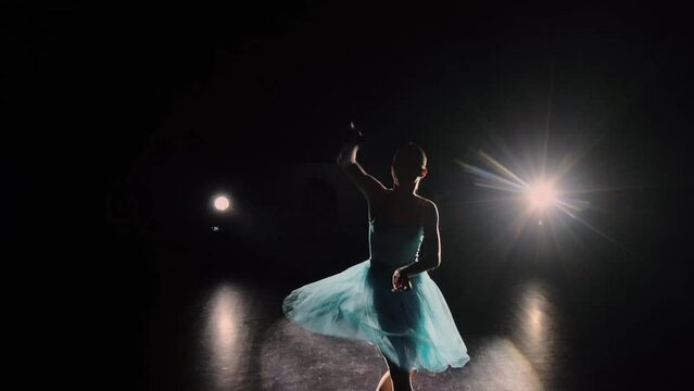 Ballerina girl dancing on stage