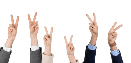 Business people showing victory gesture on white background
