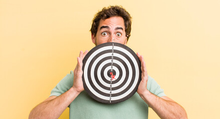young man with a darts target