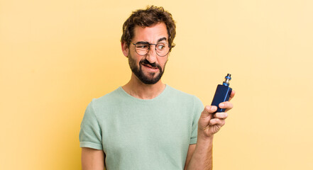 young crazy man smoking with a vaporizer
