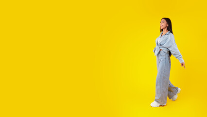 Excited woman walking looking at free copy space