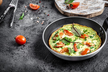 Frittata with fresh vegetables and cheese. Italian omelet in the pan. Keto, ketogenic lunch. banner, menu, recipe place for text, top view