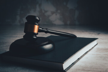 judge gavel with book on wooden background