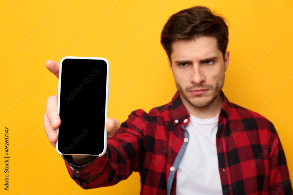 Poster sad guy holding showing empty smartphone screen