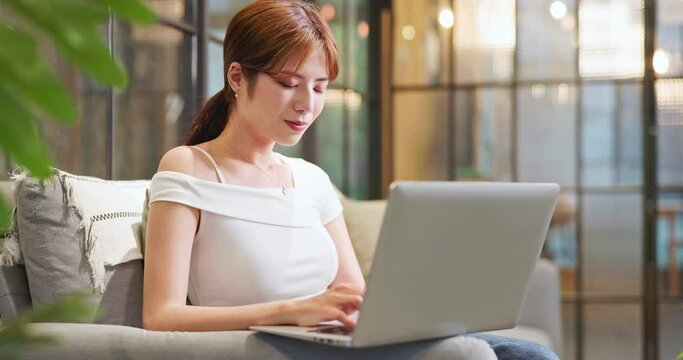 asian woman use laptop