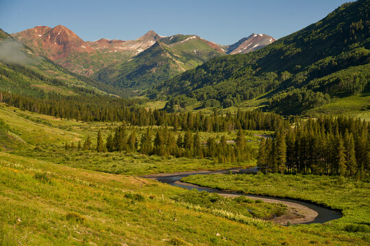 View of a river crossing the forest at Crested Butte in Colorado, United States.