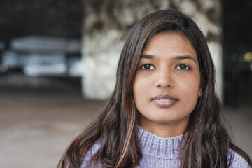 Young indian woman looking on camera