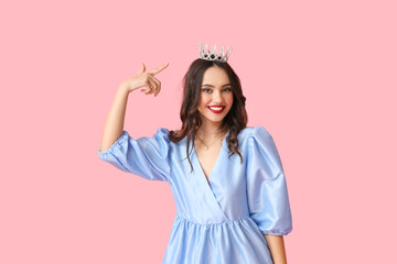 Beautiful young woman in stylish dress and tiara on pink background © Pixel-Shot
