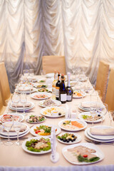 festive wedding table in the restaurant. serving food utensils