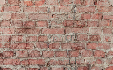 Abstract texture, horizontal brick tile background. Old and weathered red brick wall close up....