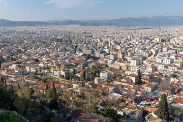 Athens Greek capital seen from above. Bird's eye view from Acropolis over the city with white houses, towers.