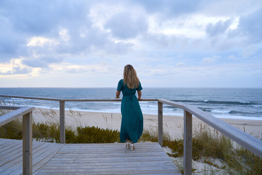 powerful girl in front of the sea making a decision
