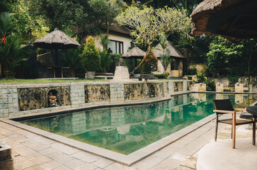 Garden in the backyard with swimming pool and cozy gazebo in Bali Indonesia