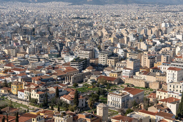 Fototapeta premium Athens Greek capital seen from above. Bird's eye view from Acropolis over the city with white houses, towers.