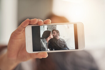 Sweet selfies with the sweetheart. Shot of an attractive young couple spending quality time at home.