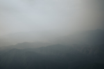 Aerial view of mountain curve with haze and warm tone