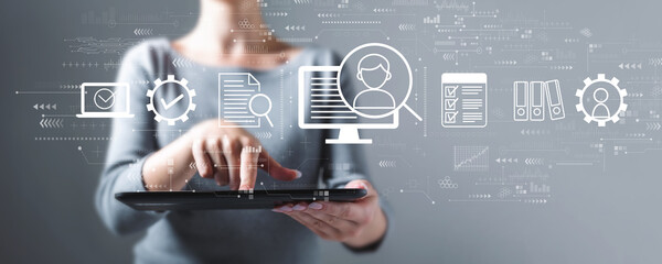 Document management system concept with business woman using a tablet computer