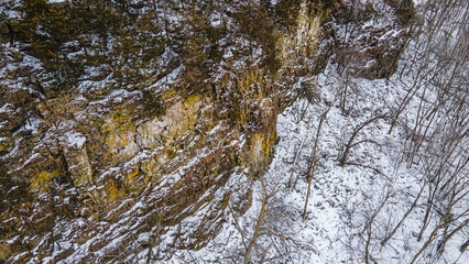 A steep icy ledge in the forest