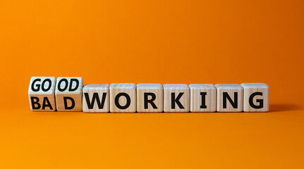 Good or bad working symbol. Turned wooden cubes and changed words bad working to good working. Beautiful orange table orange background. Business good or bad working concept, copy space.