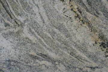 Abstract texture of gray gneiss rock background.