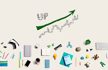 Market up trend chart with collection of electronic gadgets and office supplies