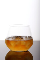 whiskey with ice on the table, close-up
