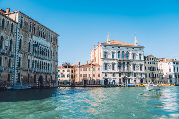 Fototapeta na wymiar Concept of touristic journey trip for visiting romantic Italian city - Venezia during summertime for travelling around Europe, landscape view of beautiful historic buildings located at Grand Canal