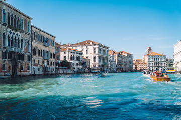 Fototapeta na wymiar Beautiful scenery landscape of most romantic European city - Venice located on Grand Canal of Adriatic sea, ancient Italian architecture buildings for visiting by motorboat taxi