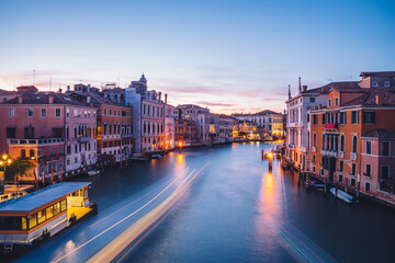 Obraz premium Filtred scenery landscape with lights on water of Grand Canal during evening time for romantic sightseeing in Venezia, overview of ancient architecture buildings during international vacations