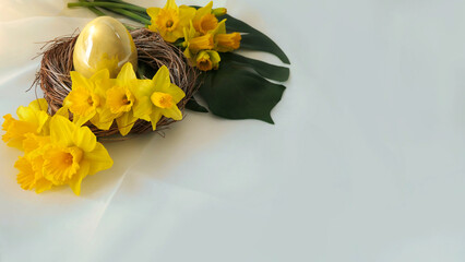 easter decoration - yellow daffodils around an egg in a wreath - copyspace card