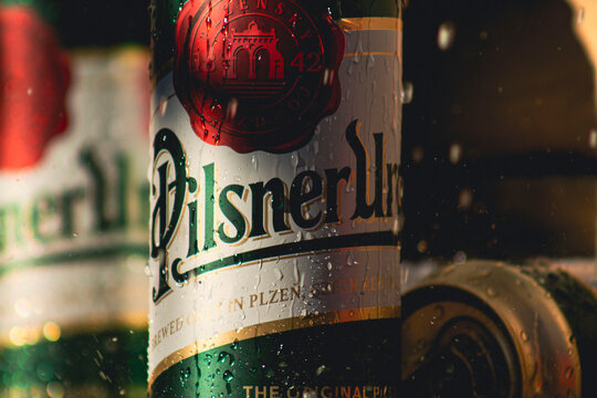 Prague, Czech Republic - March 13, 2022: Cans of Pilsner Urquell beers in the fridge. Pilsner Urquell is a Czech lager brewed by the Pilsner Urquell Brewery.
