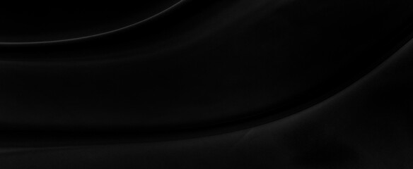 Black gray satin dark fabric texture luxurious shiny that is abstract silk cloth panorama background with patterns soft waves blur beautiful.