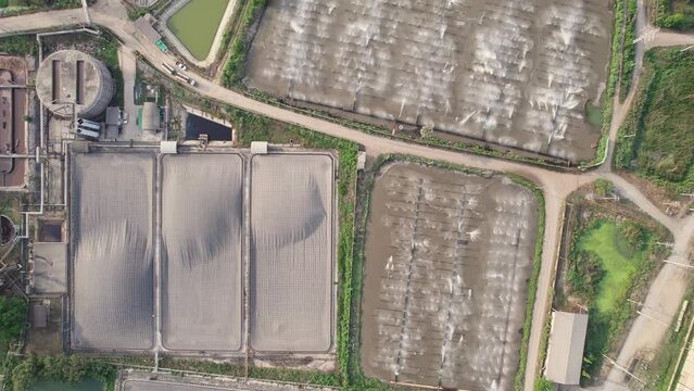 Ethanol fermentation pond with water spraying in wastewater pond at ethanal chemical manufacturing factory