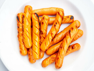 Grilled sausages on dish