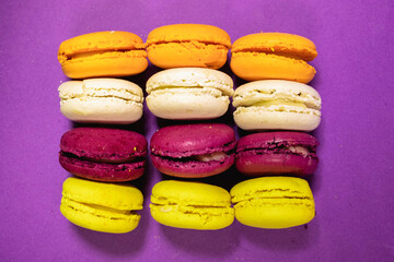 French Macaron Cookies decorated  isolated on purple background