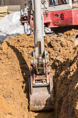 Baggern auf einer Baustelle - Minibagger