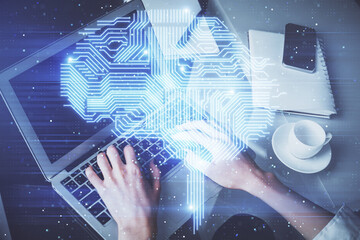 Double exposure of woman hands working on computer and brain hologram drawing. Ai concept.