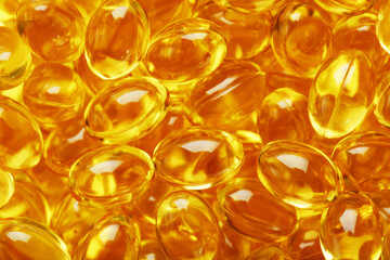 Golden Vitamin D3 Capsules close-up in full screen