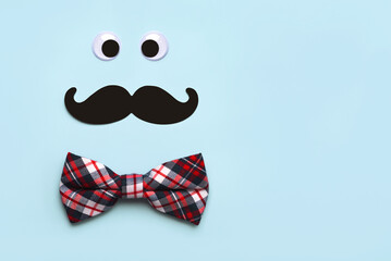 Happy Father´s Day. Top view of false mustache, eyes and bow tie with copy space. Father´s Day celebration concept