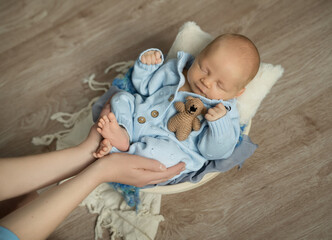 newborn baby boy in a suit sleeping on a  pillow props. Happy pregnancy and childbirth. Health concept. Happy pregnancy 
