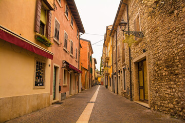 Fototapeta na wymiar A street at Christmas in the old town of Bardolino on the east shore of lake Garda, Verona Province, Veneto, north east Italy 