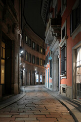 Fototapeta na wymiar A city at night, a small street in Milan, Italy ...