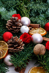 Traditional Christmas garland with fir, cones, baubles and dried oranges.